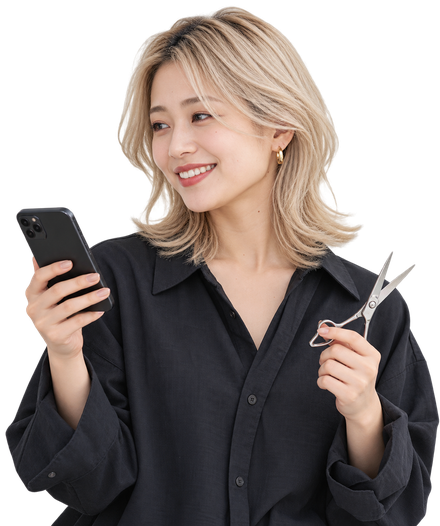 スマホで予約を確認する美容師